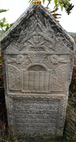 Gravestone of Zvi Hirsh, son of Yitzchak Aizik HaKohen, died 5 Iyar 5601 (26 April 1841), Siret. The carving shows the priestly hands.