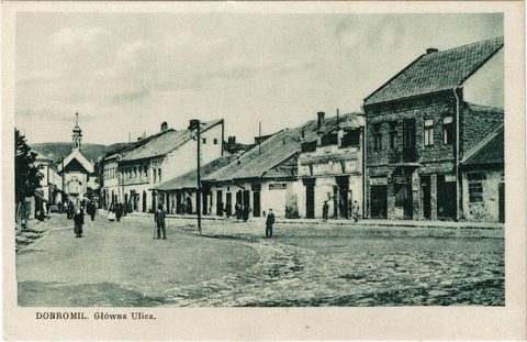 Dobromil's main street, lined with Jewish-owned shops, between 1918 and 1928. The church is in the background.